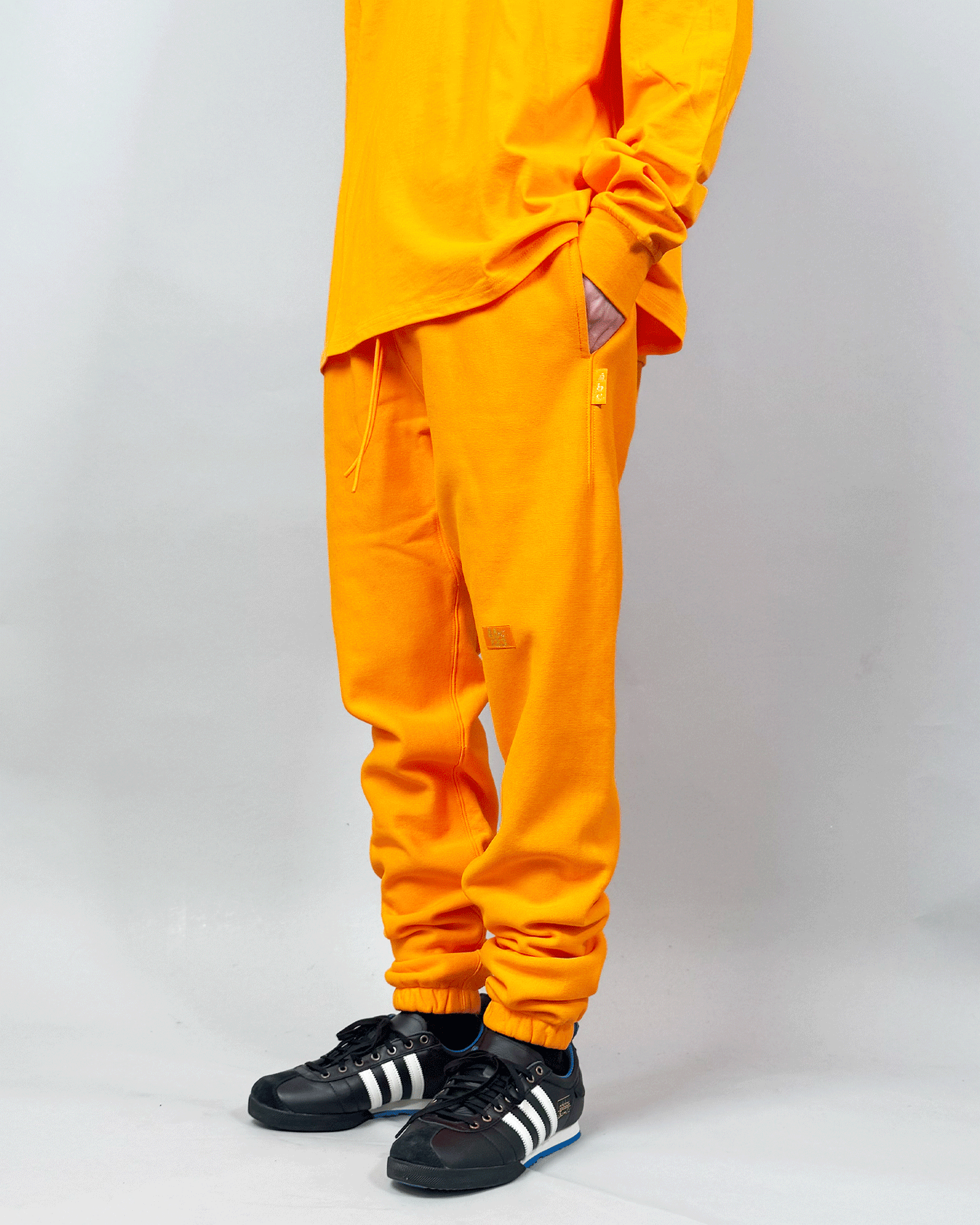 アドバイザリーボードクリスタルズ/Sweatpants/スウェットパンツ/ORANGE